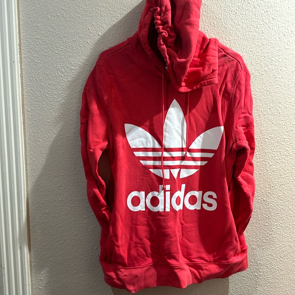 Adidas sweatshirt in coral.